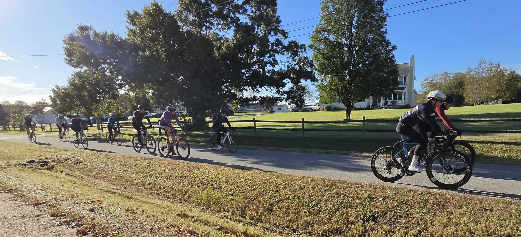 PaxVelo riders on a group ride along a country road